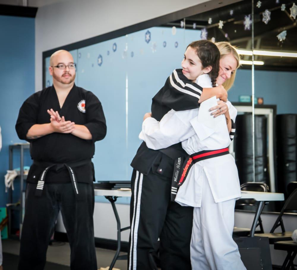 a man and a woman in karate uniforms